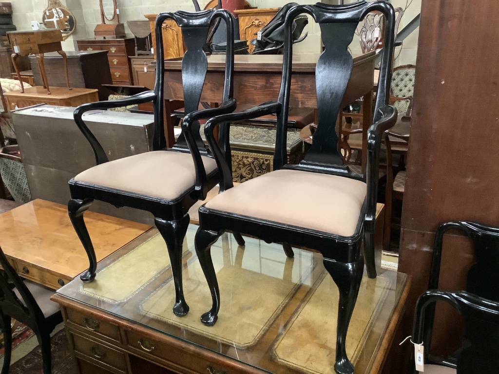 A set of six Queen Anne style ebonised dining chairs, two with arms